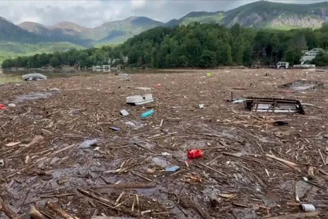 Flood debris from Hurricane Helene floats by 