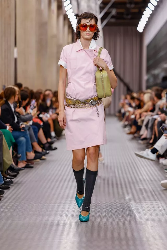 A model wears a creation as part of the Miu Miu Spring/Summer 2025 collection