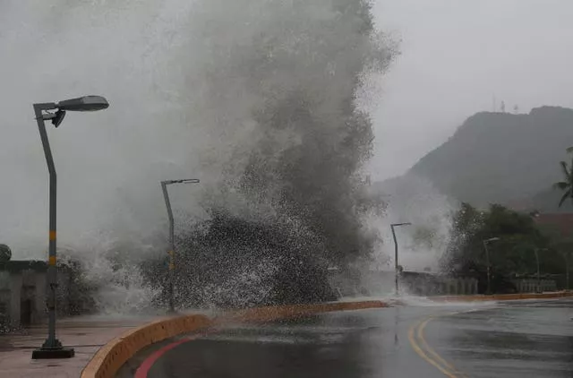 Waves crash on the coastline in Kaohsiung, southern Taiwan