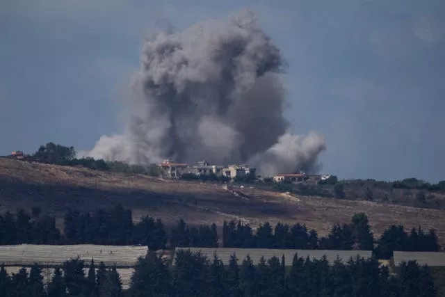 An Israeli air strike hits an area in southern Lebanon as seen from northern Israel 