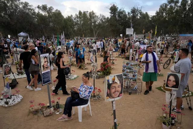 People visit the site of the Nova music festival