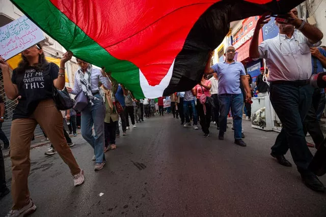 Protesters attend a rally in support of Gaza and Lebanon in Tunis, Tunisia