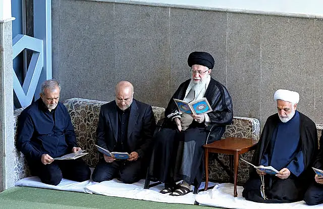 Supreme Leader Ayatollah Ali Khamenei, second right, at a ceremony commemorating killed Hezbollah leader Hassan Nasrallah at Imam Khomeini grand mosque in Tehran, Iran