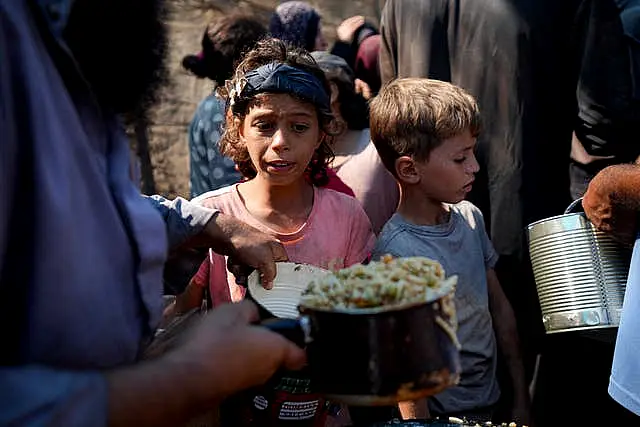 Palestinians line up for food distribution