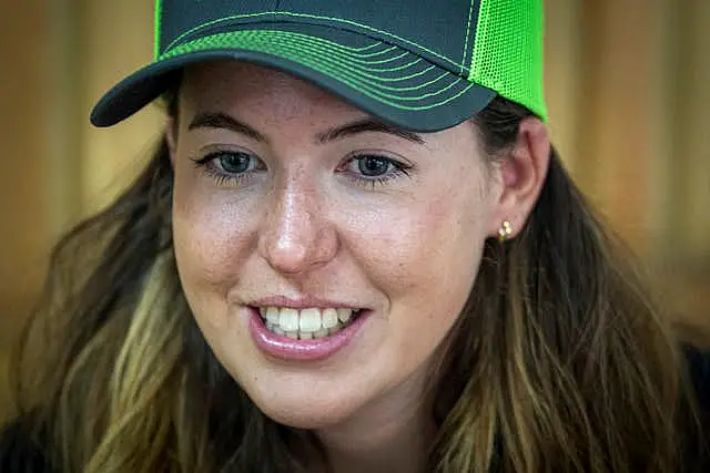 A close-up of Adriana Brownlee wearing a baseball cap