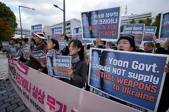 South Korean protesters stage a rally against their government’s plans to supply lethal weapons to Ukraine