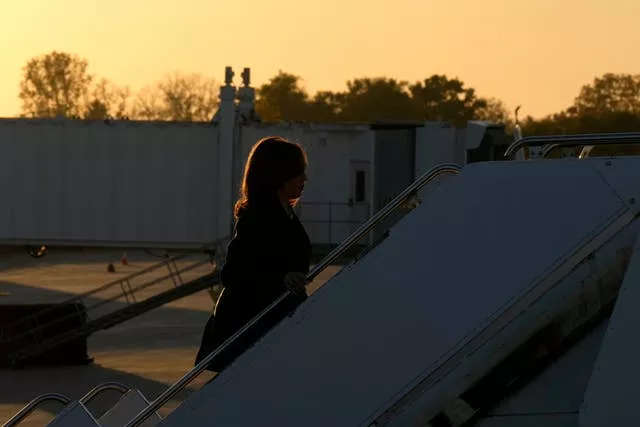 Kamala Harris boards a plane