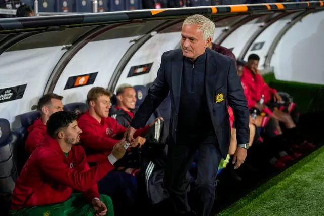 Jose Mourinho greets Manchester United’s players on their bench