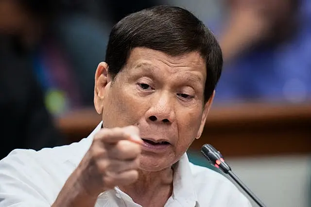 Rodrigo Duterte points at the camera