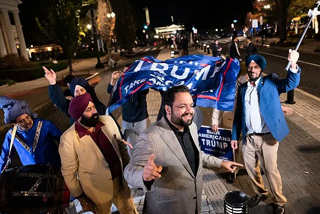 Supporters of Republican presidential nominee Donald Trump dancing outside the White House in Washington DC