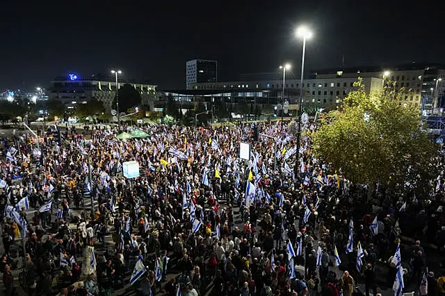 People protest against Prime Minister Benjamin Netanyahu after he dismissed defence minister Yoav Gallant