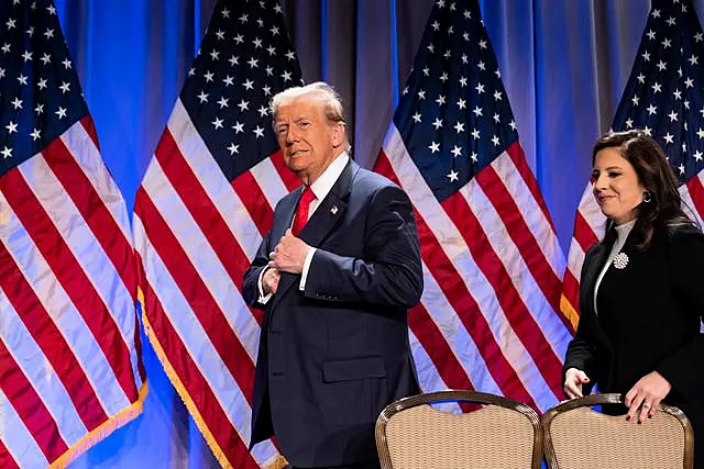 Donald Trump walks on stage followed by Elise Stefanik