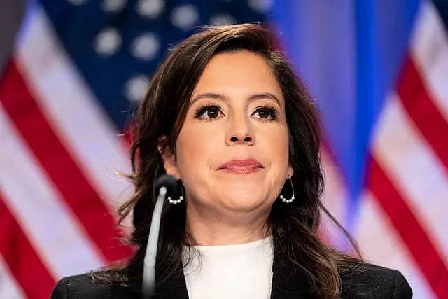 Elise Stefanik in front of the American flag