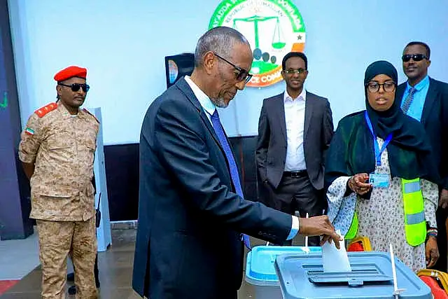 Somaliland President Muse Bihi Abdi, centre, casts his vote inside a polling station in Hargeisa 