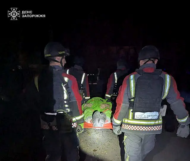 Rescuers work on a site of a Russian attack in Zaporizhzhia, Ukraine.