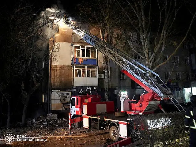 Firefighters work on a site of a Russian attack on residential area in Mykolaiv, Ukraine. 