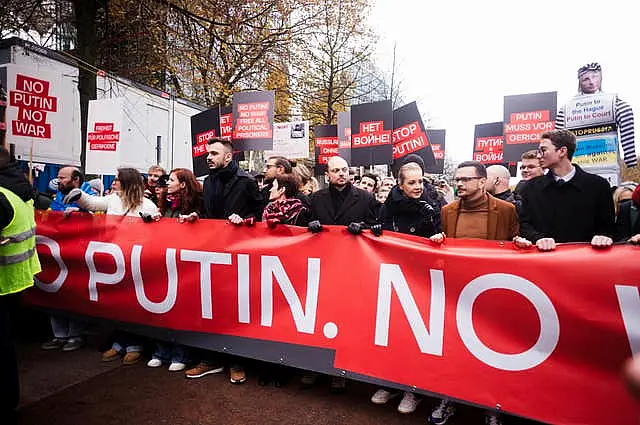 People carry a banner at a demonstration in Berlin