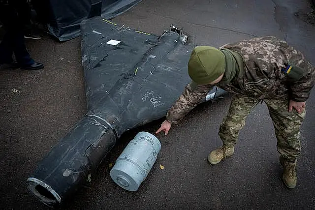 Soldier examines a drone