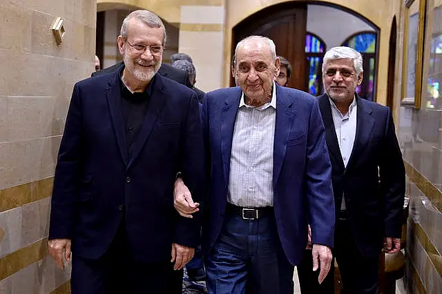 Nabih Berri, centre, walks with Ali Larijani, an adviser to Iran’s supreme leader Ali Khamenei