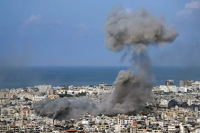 Smoke rises after an Israeli air strike on Dahiyeh