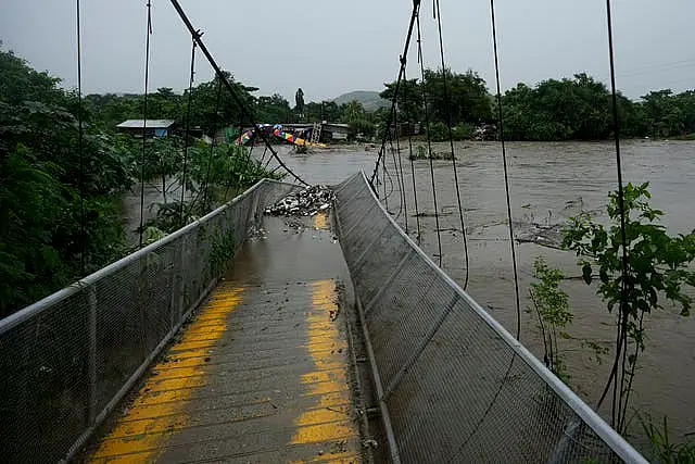 A pedestrian bridge in Honduras collapsed after flooding