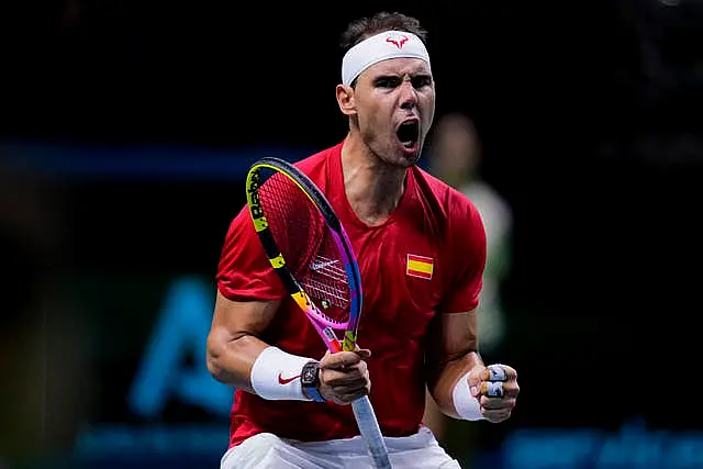 Rafael Nadal pumps his fists after winning a point