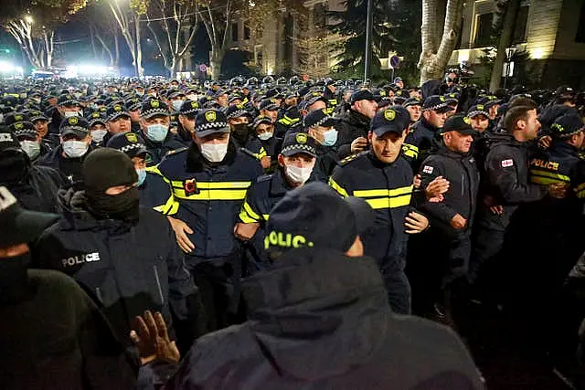 Police block a street during a rally in Tbilisi