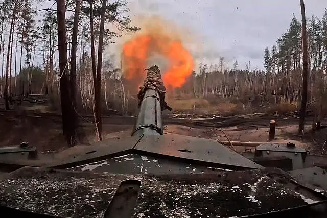 A Russian T90M Proryv tank fires towards Ukrainian positions 