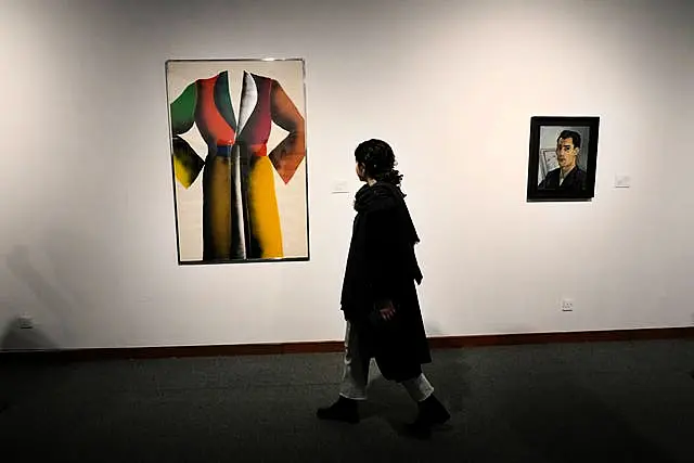 A woman visits an exhibition titled Eye to Eye which showcases over 120 works by modern world artists as well as Iranian painters at Tehran Museum of Contemporary Art