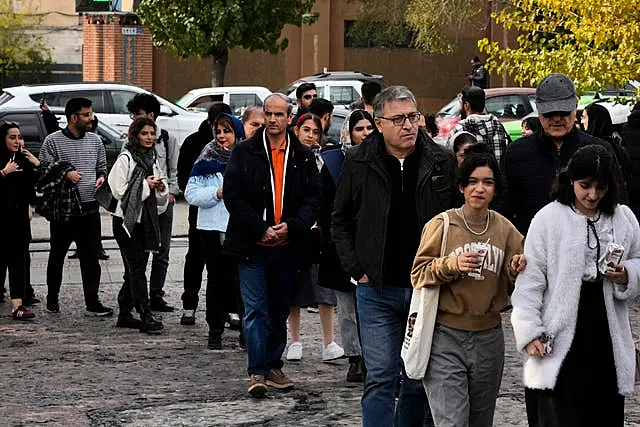 Iranians line up to visit an exhibition titled Eye to Eye 