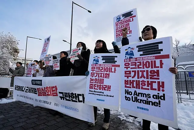 South Korean protesters stage a rally against their government’s plans to supply weapons to Ukraine,