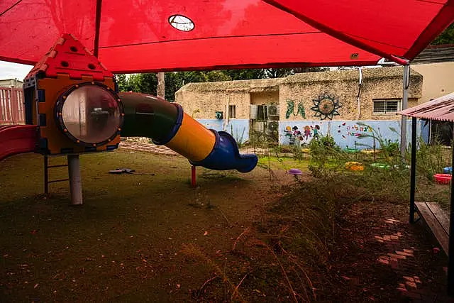 Weeds grow in a deserted playground in northern Israel