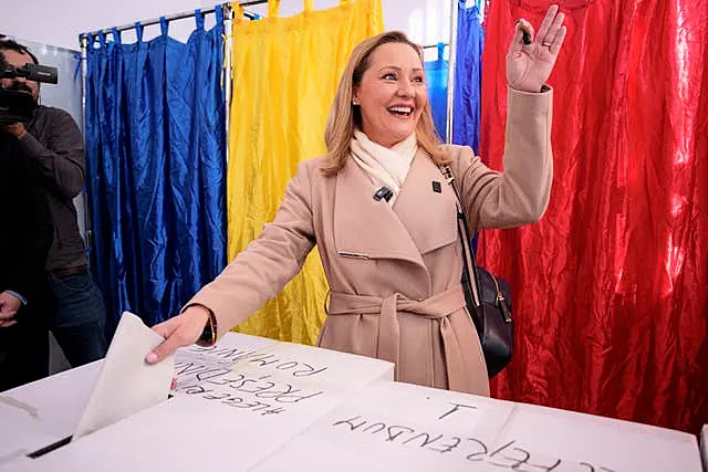 Elena Lasconi smiles while casting ballot