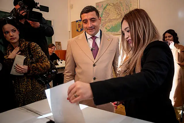 George Simion and wife voting