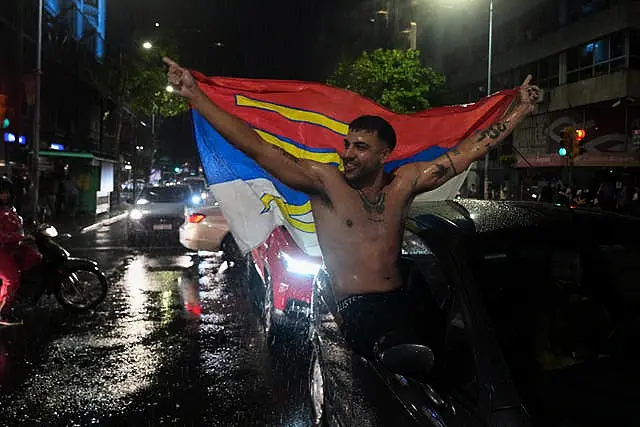 Supporters of the Broad Front (Frente Amplio) celebrate