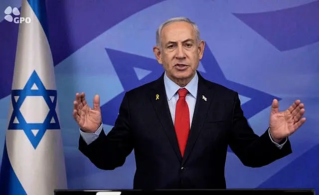 Israeli Prime Minister Benjamin Netanyahu gestures as he makes a televised statement