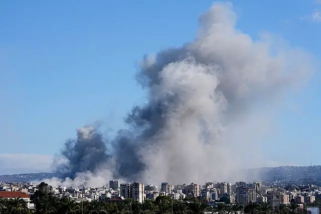 Smoke rises between buildings hit in Israeli airstrikes in Hosh neighbourhood, in Tyre