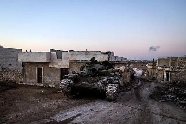 A destroyed Syrian army tank in the village of Anjara