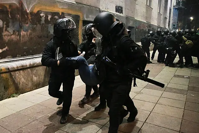 Police detain a demonstrator in Tbilisi 