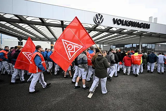 Volkswagen workers with flags