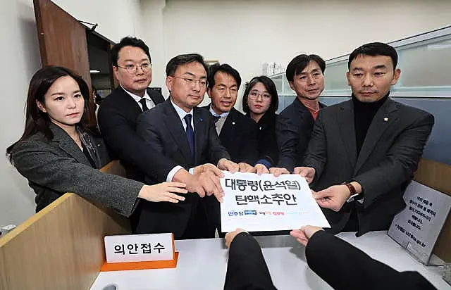 South Korean lawmakers of the main opposition Democratic Party and other minor opposition parties submit a bill to impeach President Yoon Suk Yeol