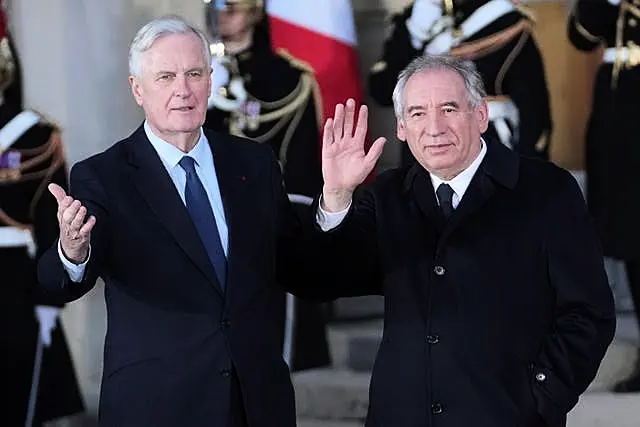 Michel Barnier and Francois Bayrou wave