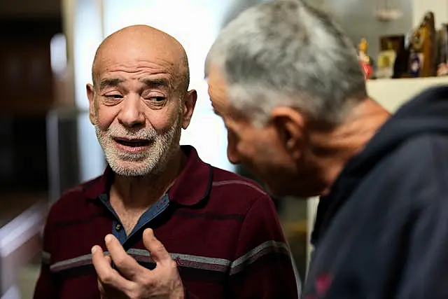 Freed man reacts when man shows him photo of missing Lebanese prisoner