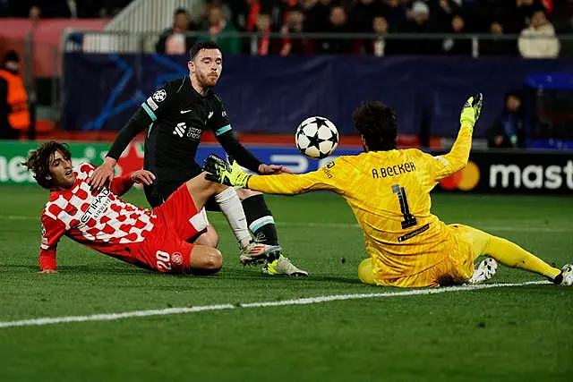 Liverpool’s goalkeeper Alisson Becker from Girona’s Bryan Gil