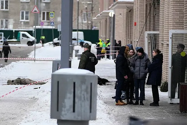 Investigators work at the site of the explosion