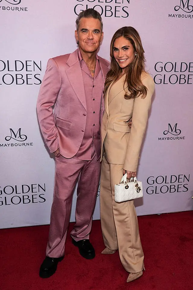 Robbie Williams, left, and Ayda Field Williams arrive at the Golden Globes first-time nominee celebration