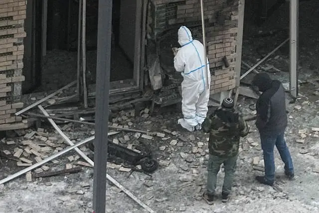 Investigators work near a scooter at the site where Lt Gen Igor Kirillov, the head of Russia’s Nuclear, Biological, and Chemical Defence Forces and his assistant Ilya Polikarpov were killed by an explosive device planted close to a residential apartment block in Moscow, Russia 