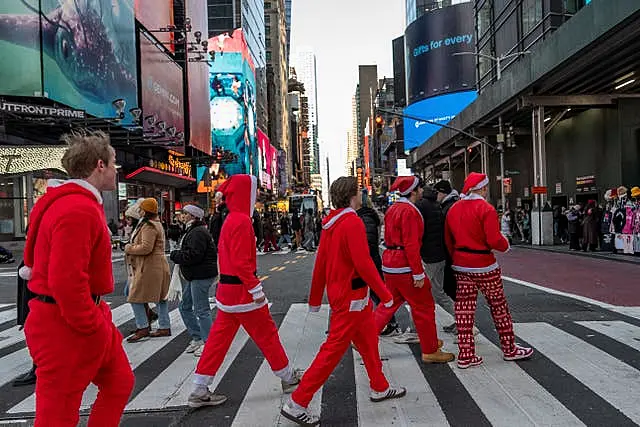 People dressed as Father Christmas