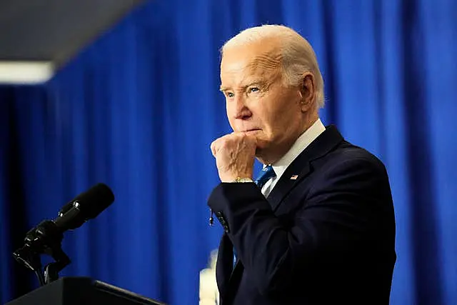 Joe Biden with his hand on his chin