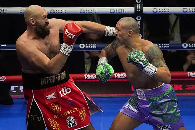 Britain’s Tyson Fury, left, and Ukraine’s Oleksandr Usyk in action